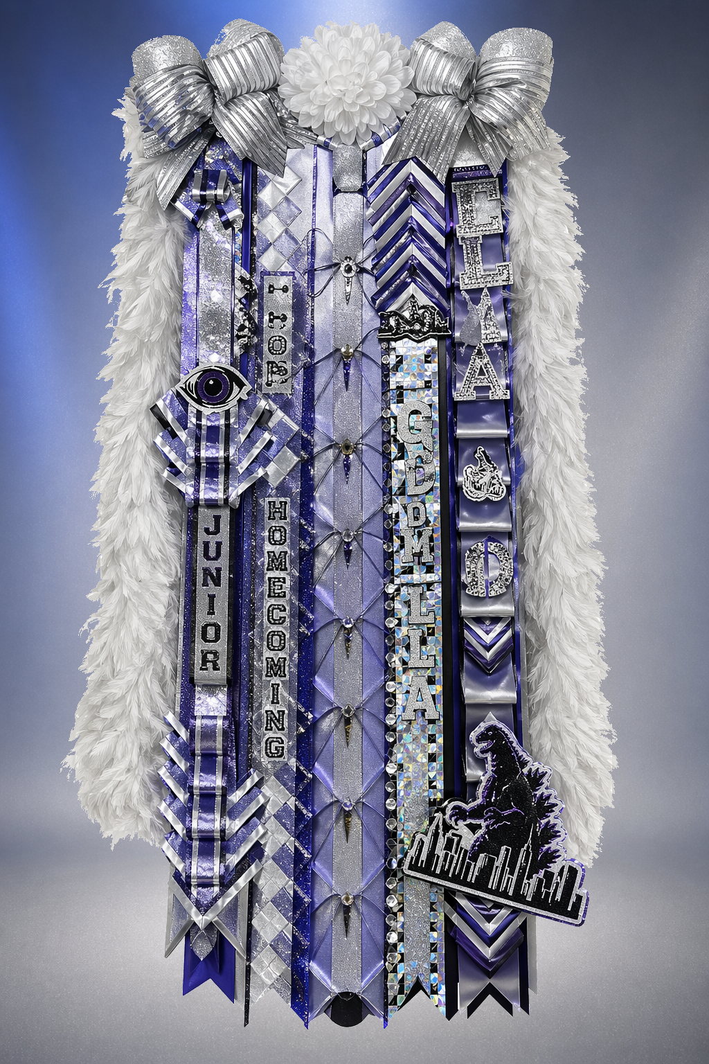 Silver and blue ELLA Junior homecoming mum with Godzilla